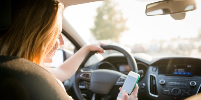Girl texting at the wheel