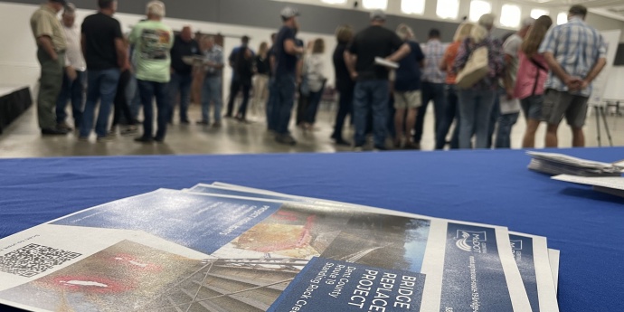 Community members are a public meeting.
