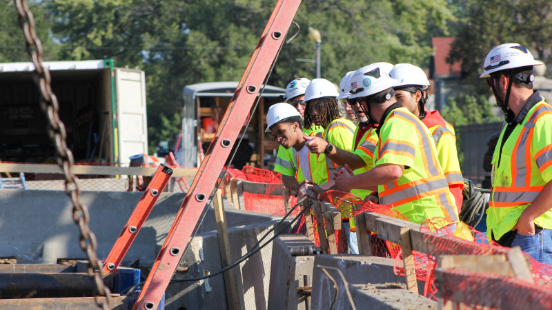 Group of students take tour of construction site