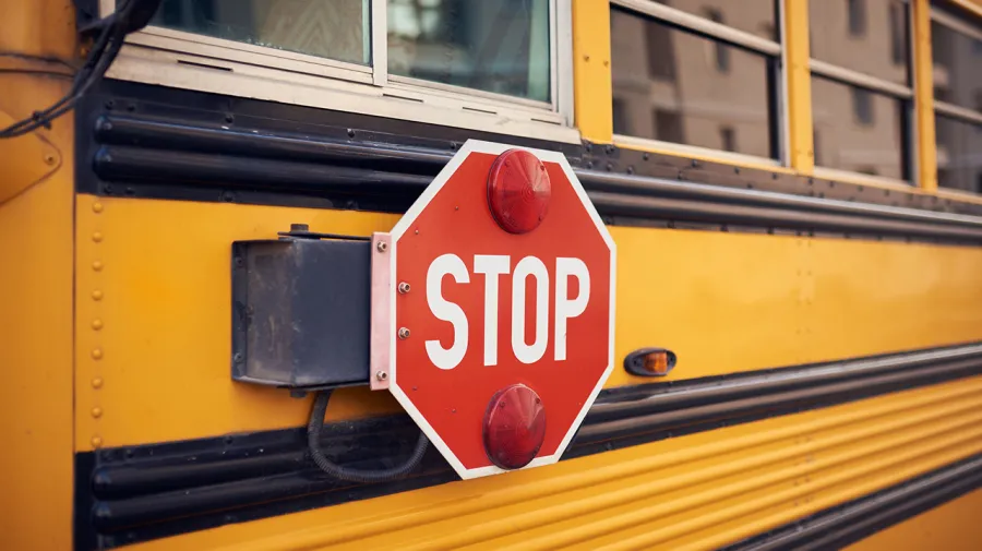 stop for school buses logo