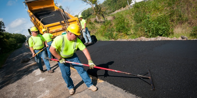 MoDOT worker pouring asphalt