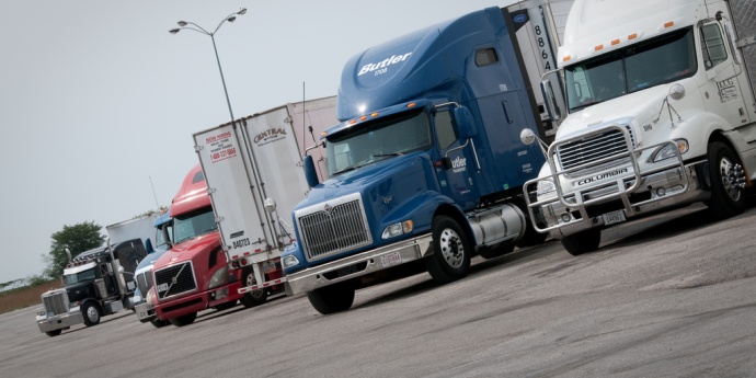 A colorful line of trucks park at a rest area