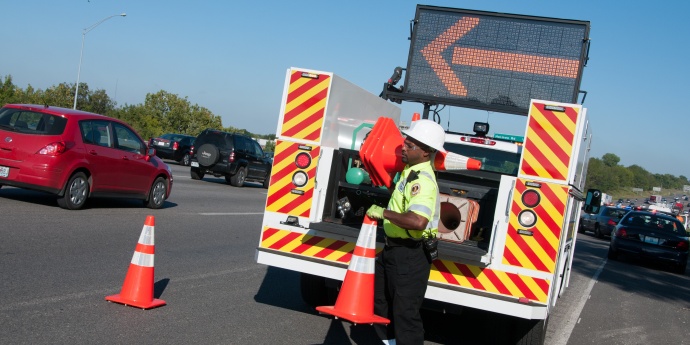 an incident response worker sets cones