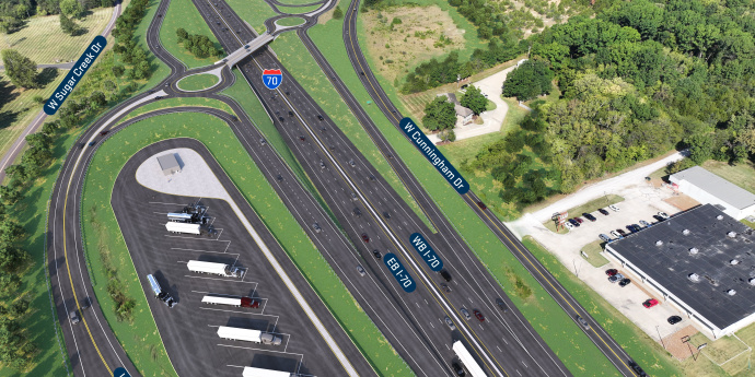 Display shows future improvements at I-70 and Midway including a new dogbone interchange, relocated eastbound I-70 on ramp, and new truck parking facilities.