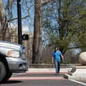 Pedestrian crossing road at an enhanced pedestrian crossing.