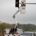 Sign crew installing signage and signals