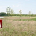 a for sale sign on a piece of land