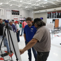 MoDOT employee Tanner Poor engages with a private citizen at a public meeting
