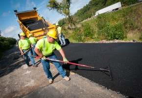 MoDOT worker pouring asphalt