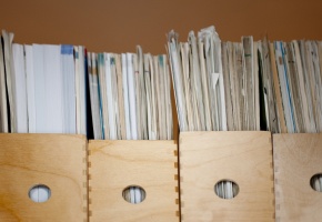 a shelf of archived papers