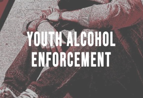 a teenager sits in front of a crash