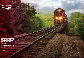 2026 SFRP Cover with orange train traveling over truss rail bridge