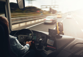 Driver operating a bus on a highway