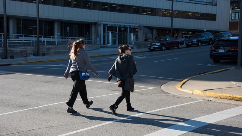 Pair of women properly crossing street