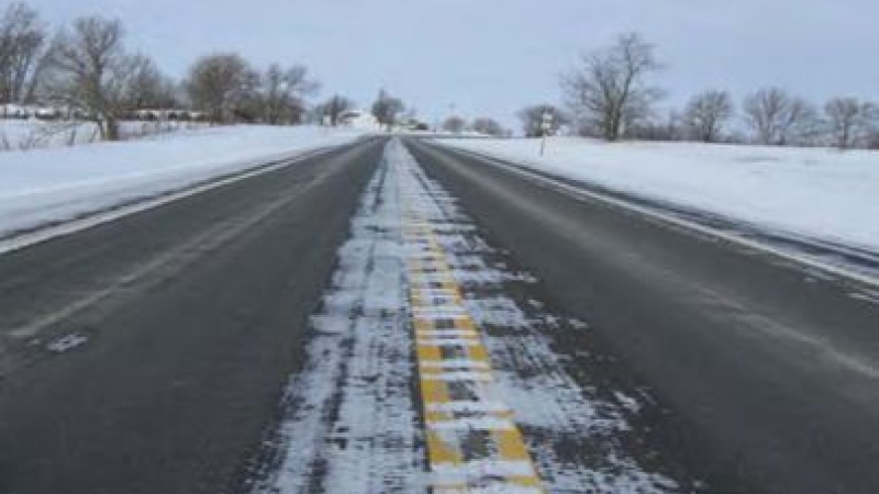 a highway that is mostly cleared of snow