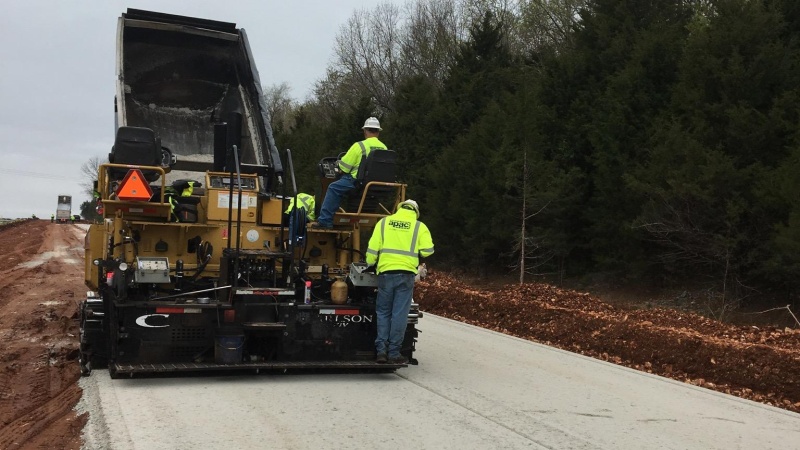 Crews laying base rock for new lanes