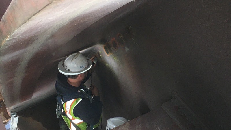 Crews inspect and repair the JB bridge
