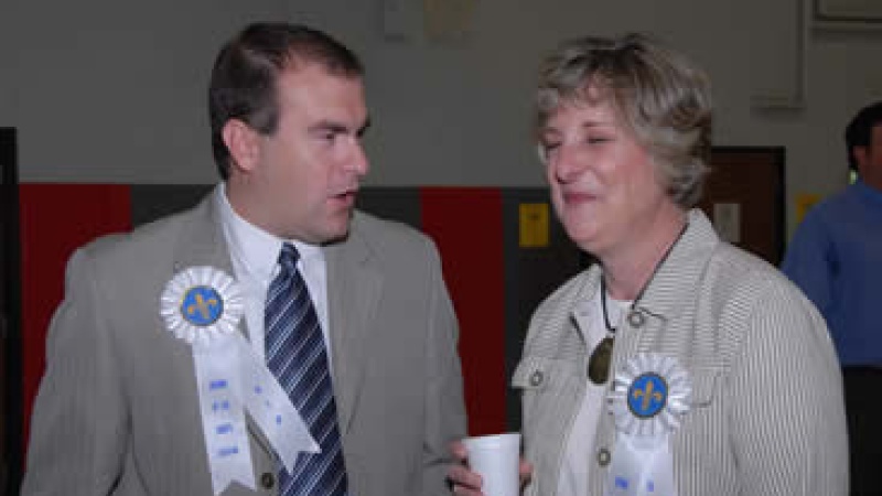 People talking at ceremony