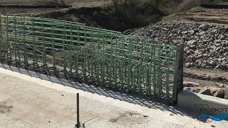 Crews pour the barrier curb on the Mozingo Creek Bridge April 25 2022