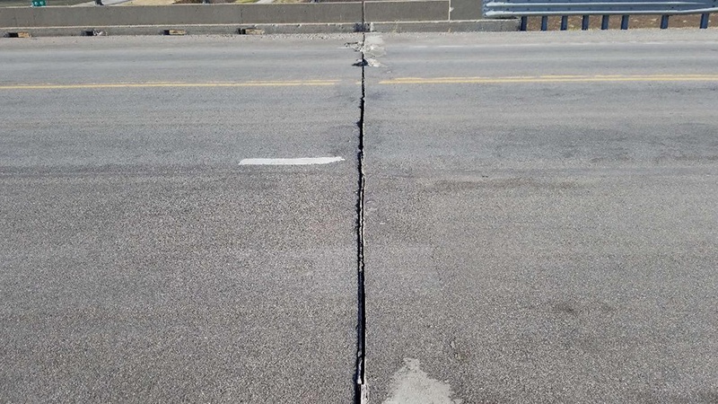 A view of the deteriorating expansion joint on the south end of the Carroll County US Rte 24 bridge over MO 10, OR 24 and NS RR