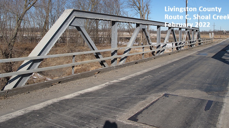 Photo of the bridge deck and truss structure taken while standing in the driving lanes of the bridge on the Livingston County Route C Shoal Creek Drainage Ditch Bridge