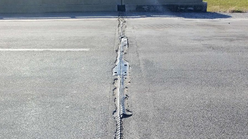 A view from one side of the Carroll County US Rte 24 bridge over OR 24 and BNSF RR showing a deteriorating expansion joint