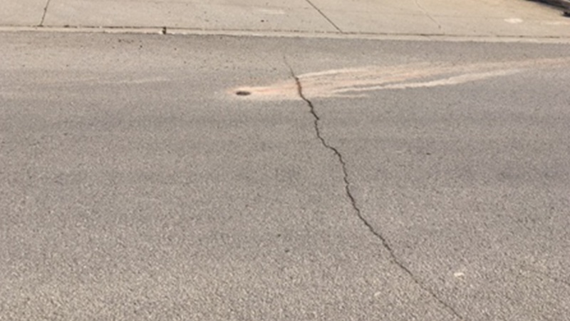The roadway at the corner of First and Laura in Maryville taken 2021 during core drilling showing a crack in the pavement that goes the width of the roadway