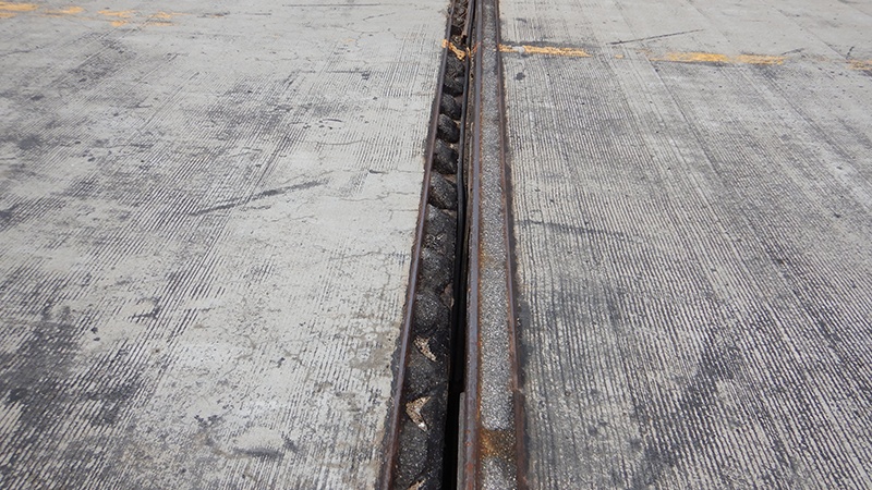 A bridge joint failing on the deck of the Carroll County Route M Grand River Bridge