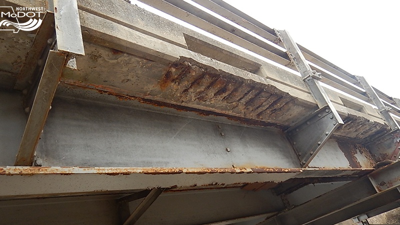 Gentry County Route E showing exposed rebar on the underside of the bridge deck's edge