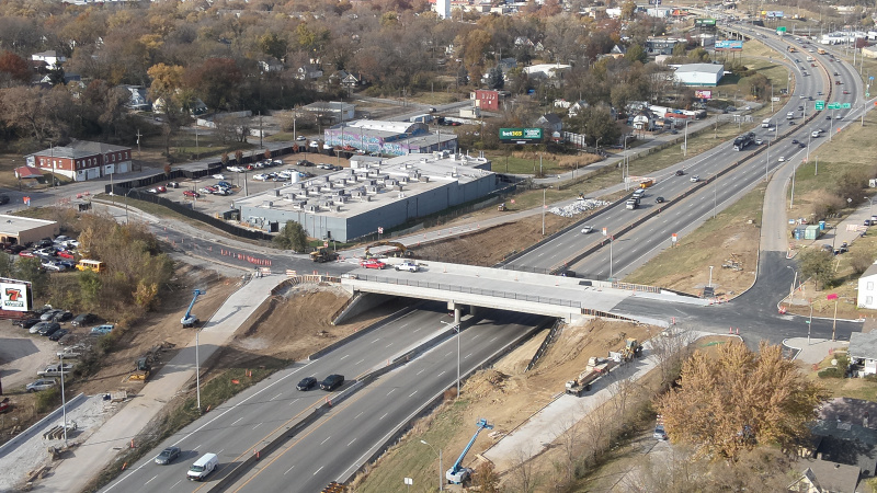 Aerial view of an urban-area bridge being constructed over an interstate