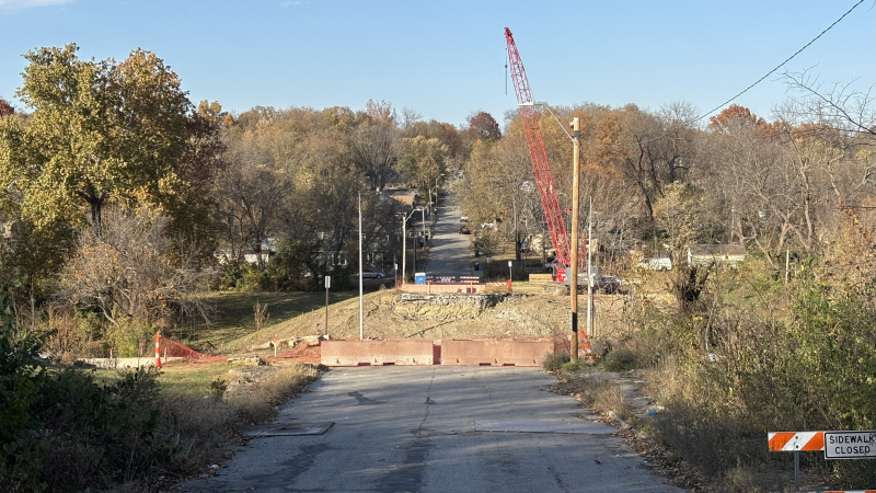 Road blocked due to bridge out, crane in background