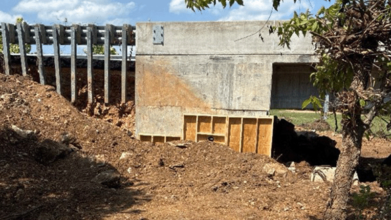 Photo of a bridge end showing concrete forms in place