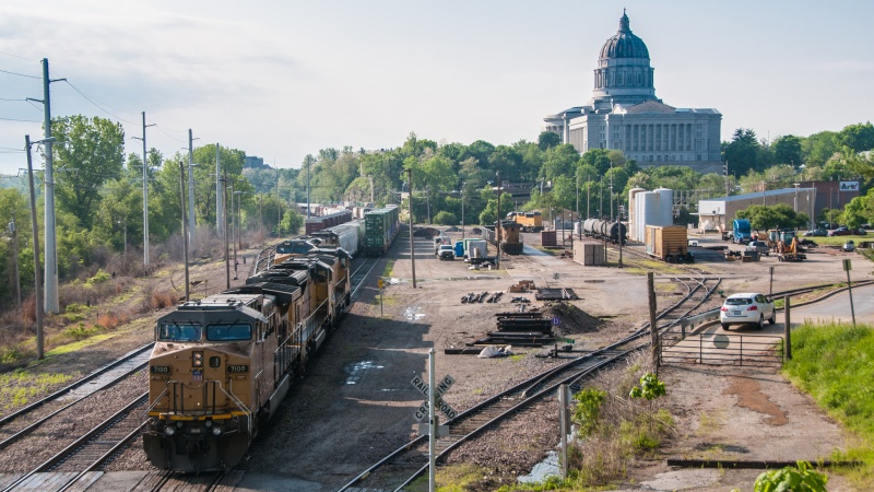 Trains with Missouri Capitol building in background