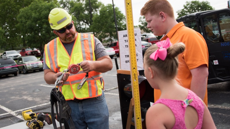 MoDOT employee discussing tools with members of the public