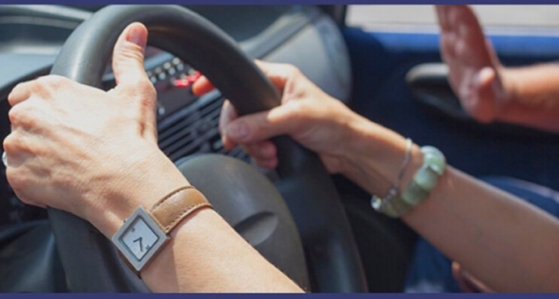 hands on a steering wheel